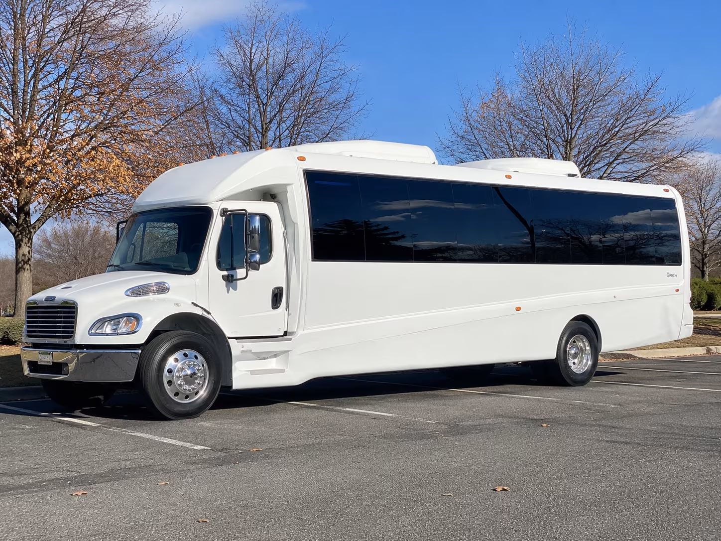 Group beside a Mercedes Sprinter limo in Atlanta